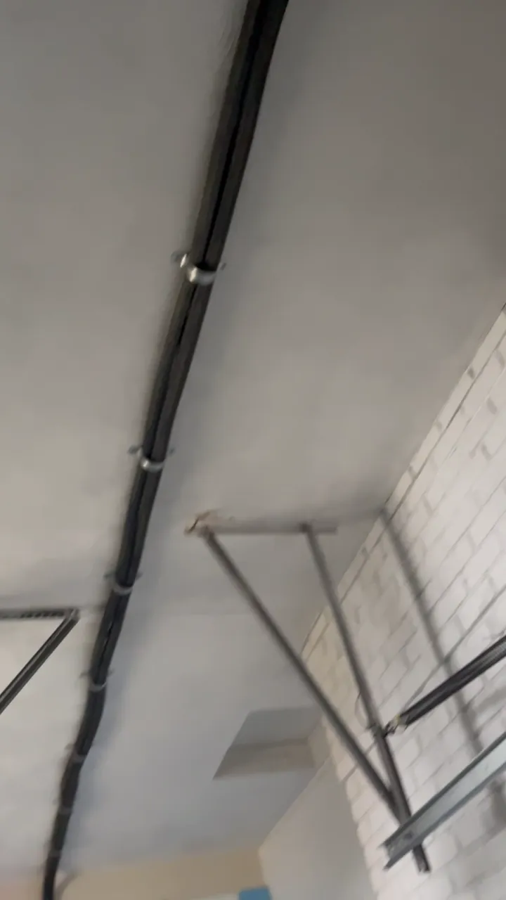 A clean line-set run along the ceiling