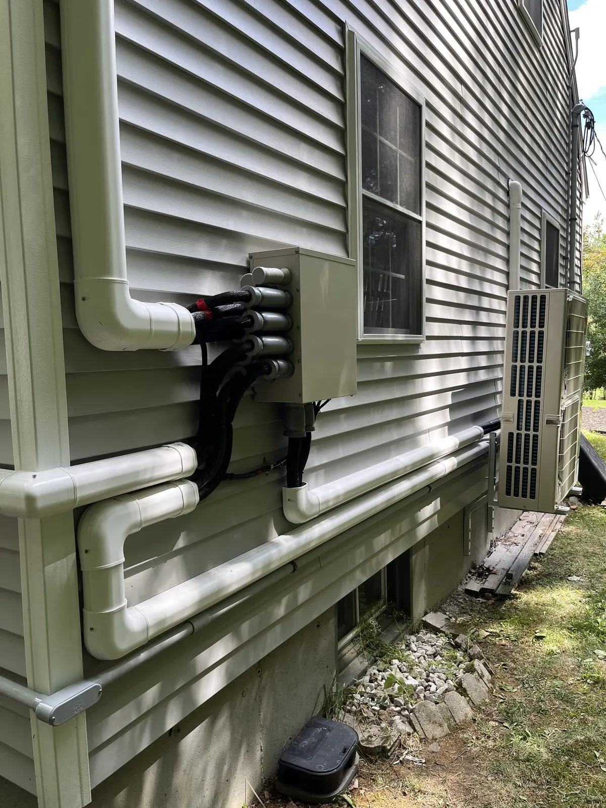 Clean line-hide run down the siding by TJM Climate Control, Southern NH & northern MA